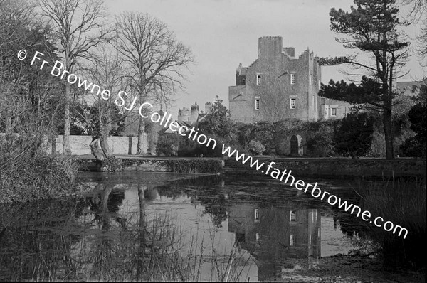 HOWTH CASTLE  LUTYEN'S TOWER (1911) AND STABLES FROM POND